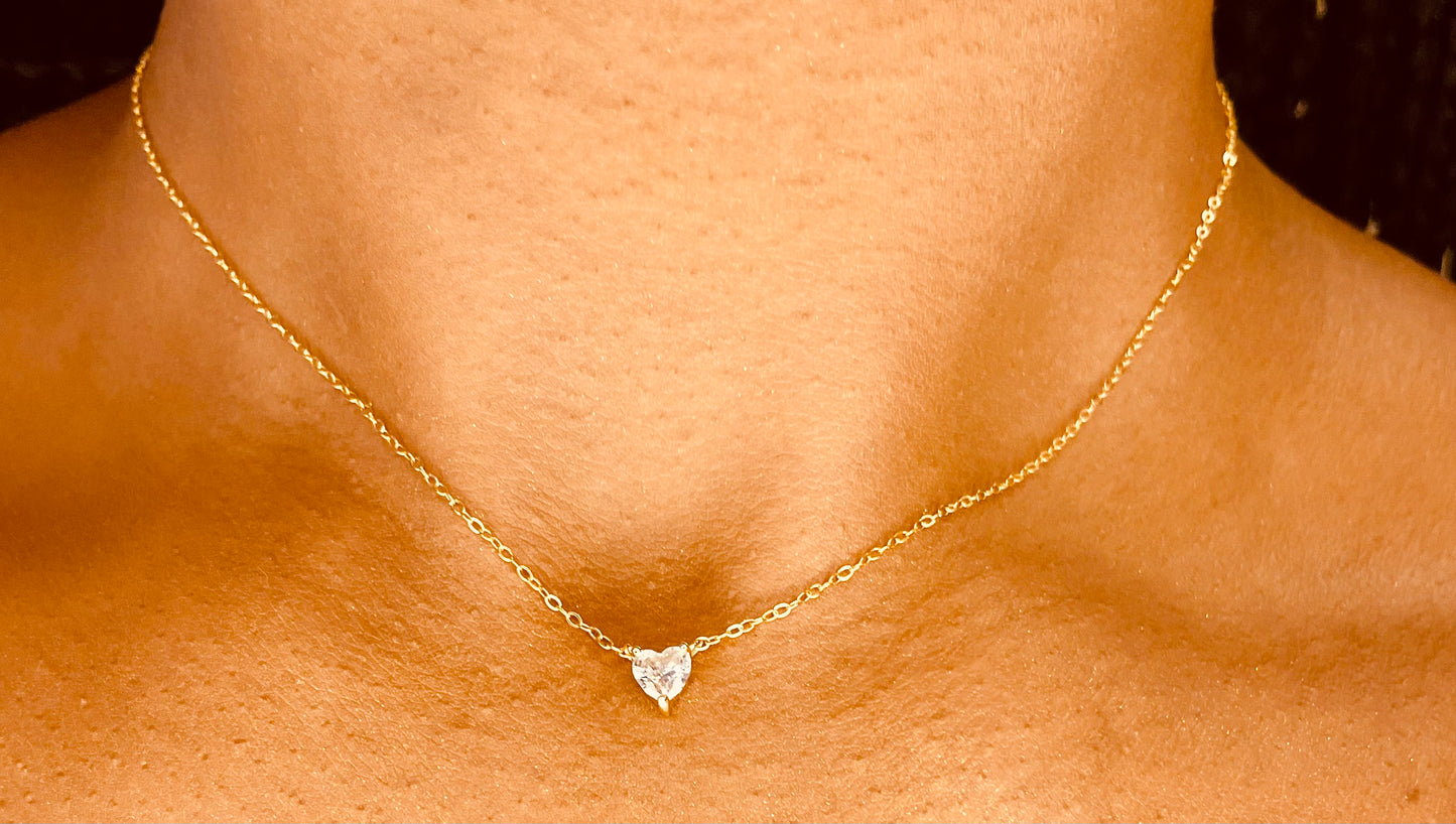 Close-up of tarnish-proof dainty heart 18K gold plated necklace, showcasing intricate heart pendant details for timeless charm.