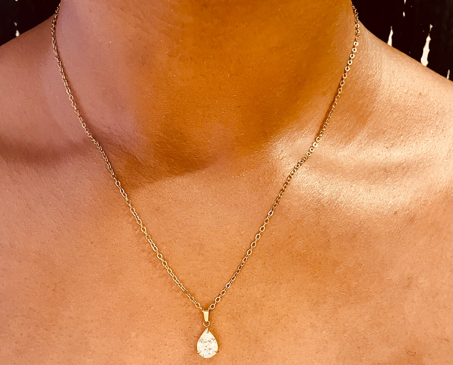 Stylish 18K gold plated pear drop necklace worn by a model, highlighting its chic design from GeorgiaReneeBoutique.