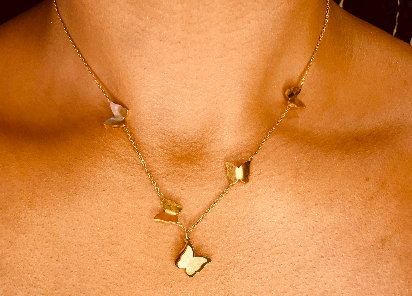 “Elegant 18k gold plated butterfly pendant necklace for women, worn by model”