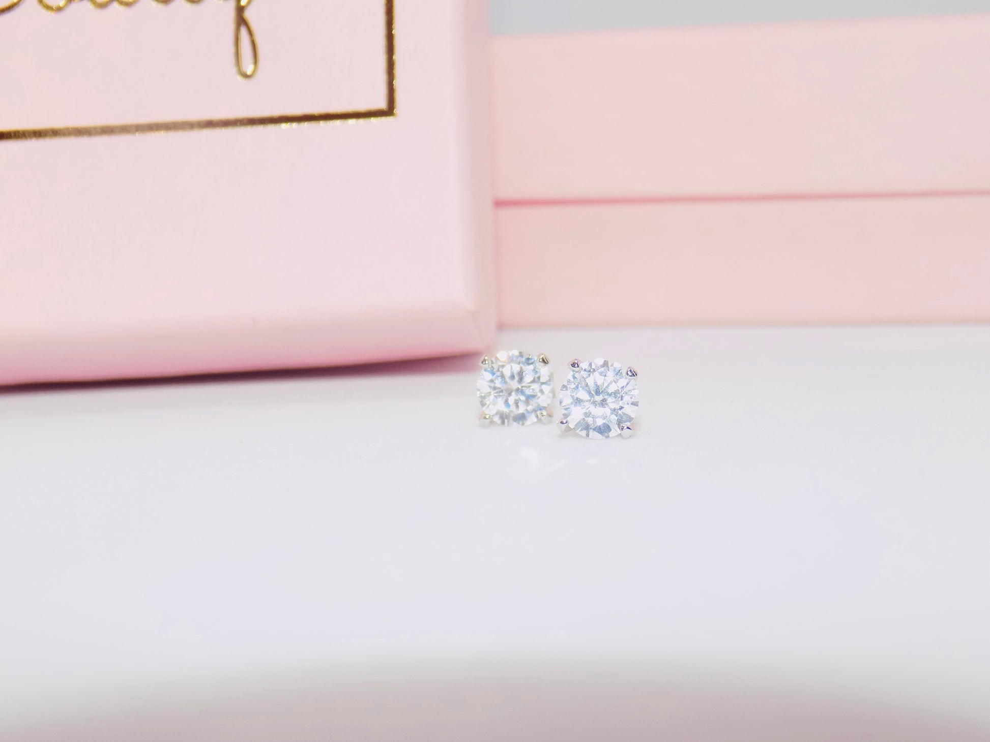 Close-up of tarnish-proof 925 sterling silver cubic zirconia stud earrings with a sleek geometric design for timeless style.