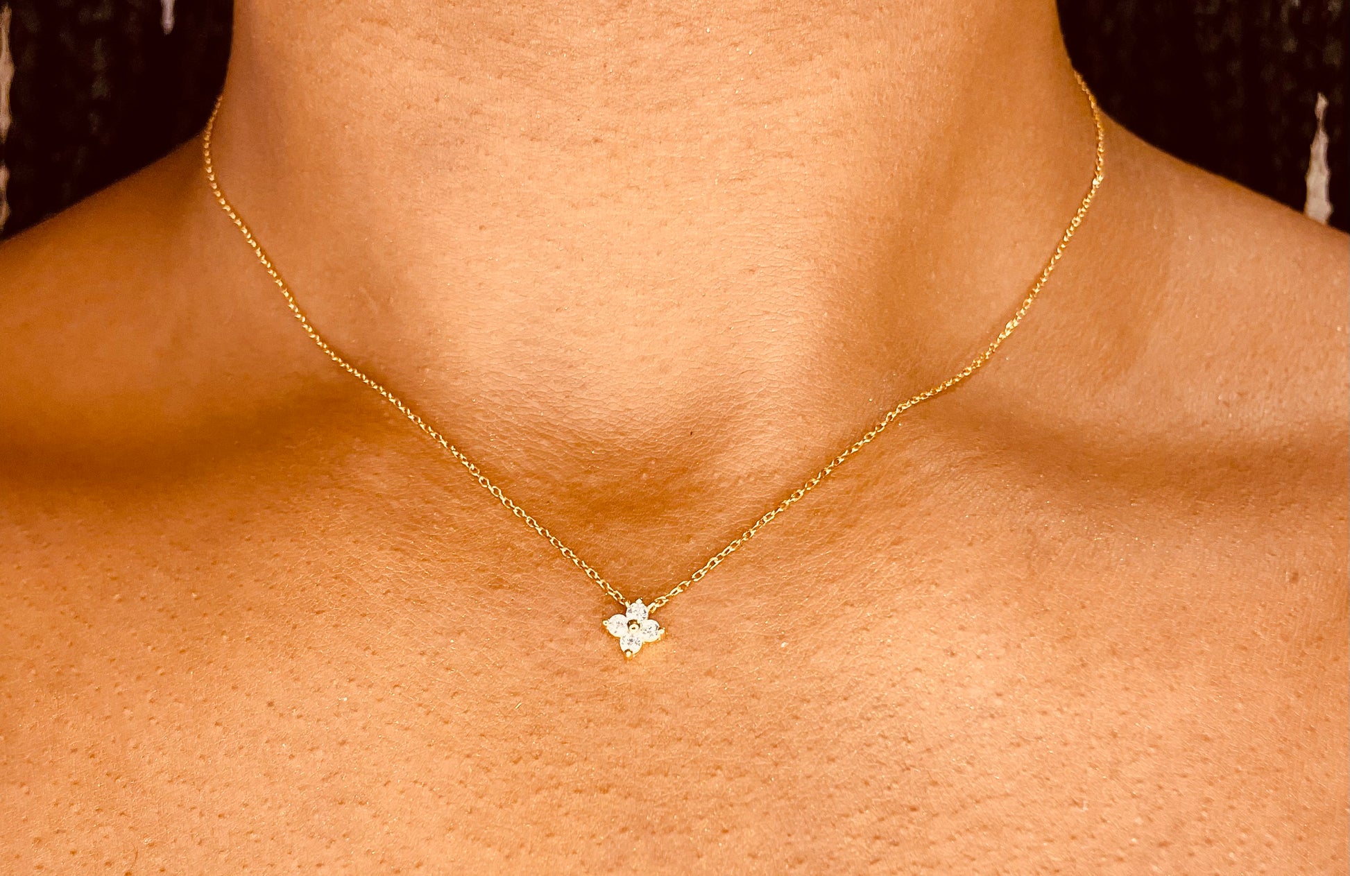 Side view of tarnish-proof Single Four Leaf 18K gold plated 925 sterling silver necklace, featuring a delicate chain and clover pendant.