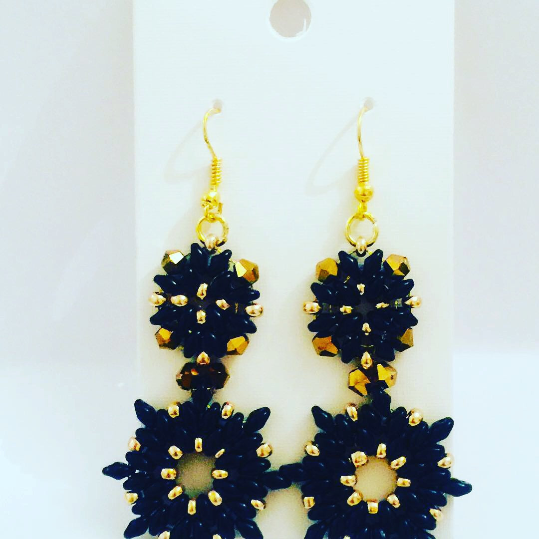 Side view of Valentina tarnish-proof 18K black plated chandelier earrings, highlighting delicate design and crystal sparkle.