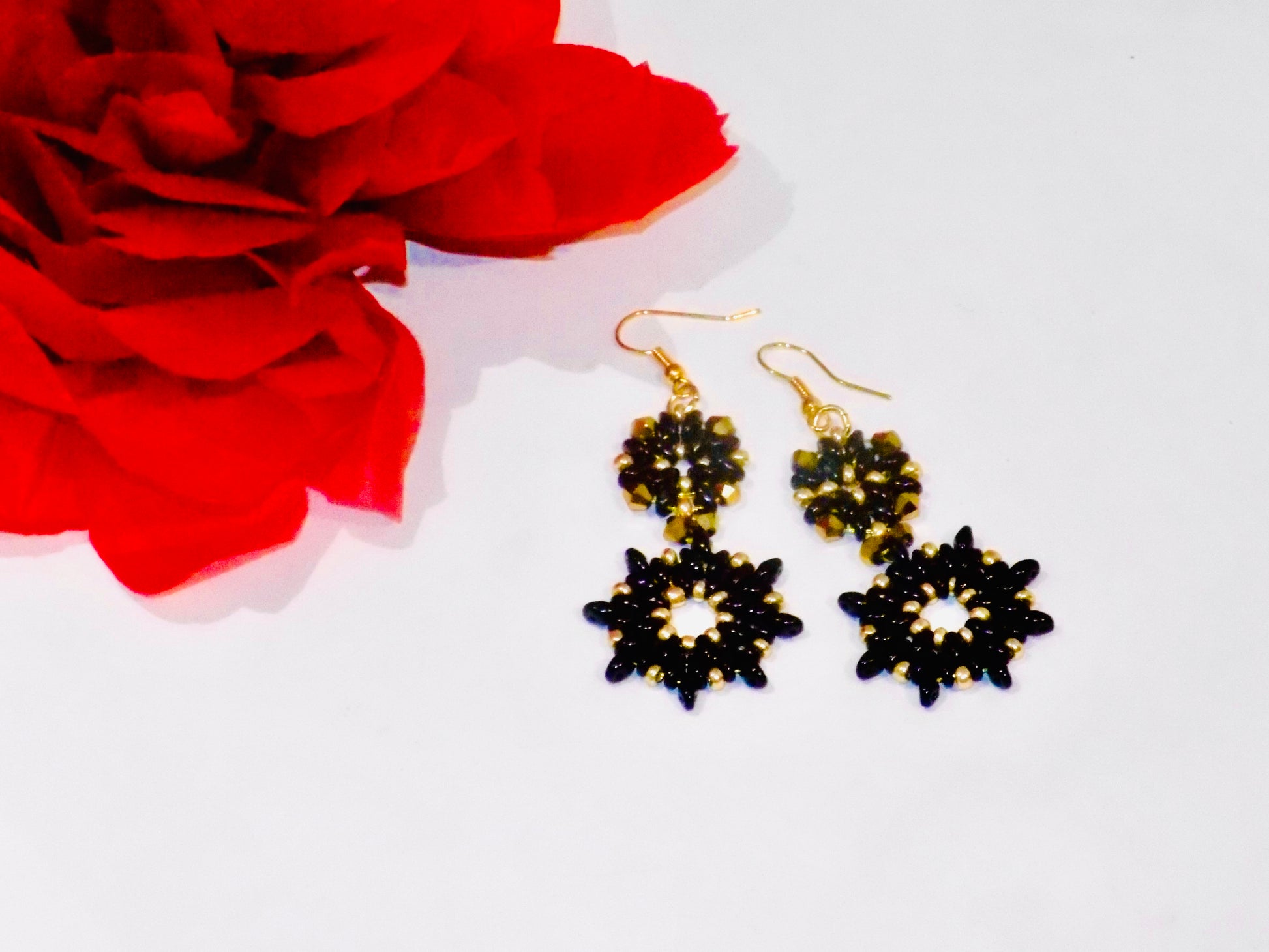 Close-up of Valentina tarnish-proof 18K gold plated chandelier earrings, showcasing intricate beadwork and sparkling crystals.