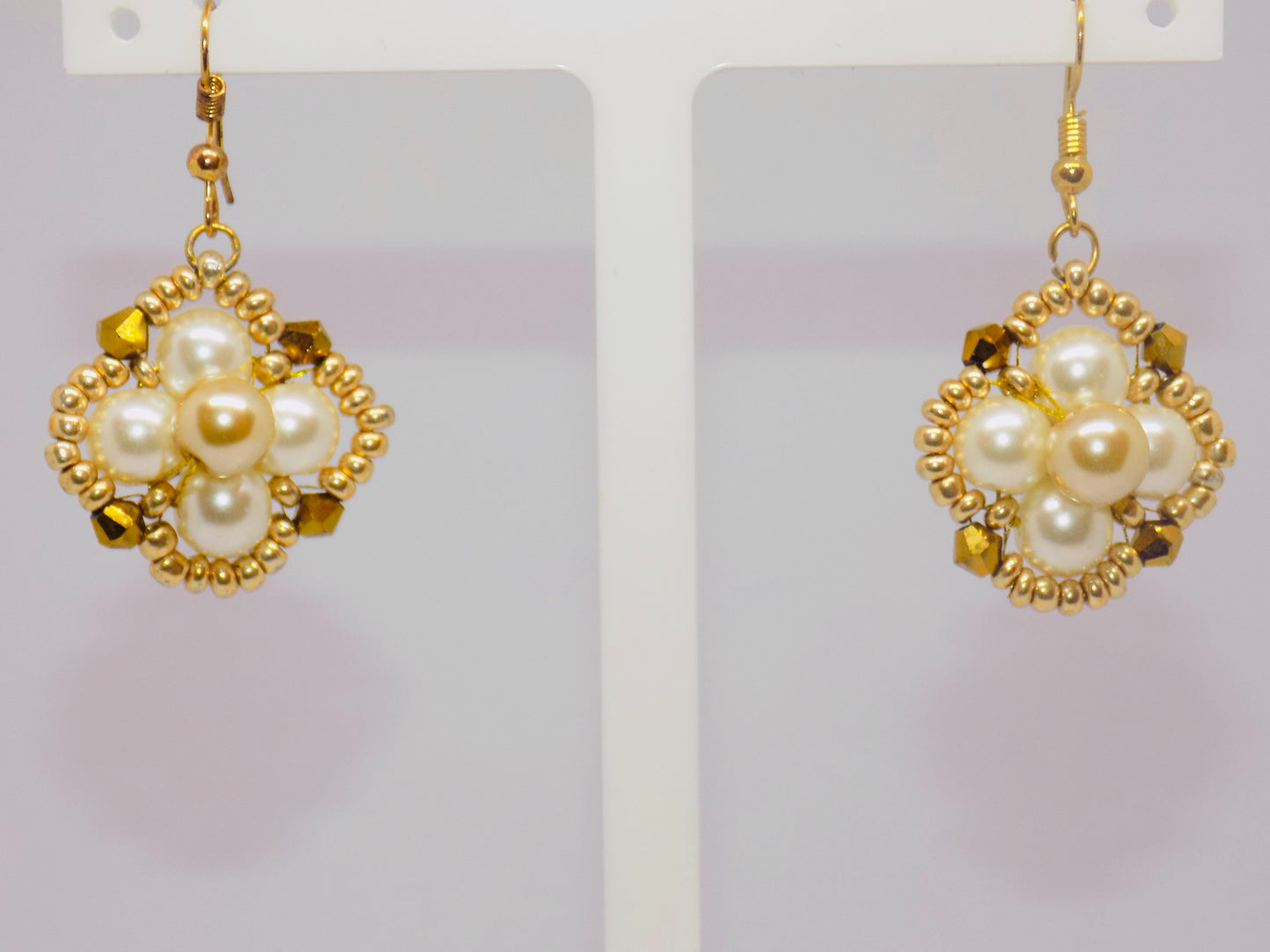 Side view of the Winsome tarnish-proof 18K gold plated necklace, featuring a delicate chain and captivating pendant design.