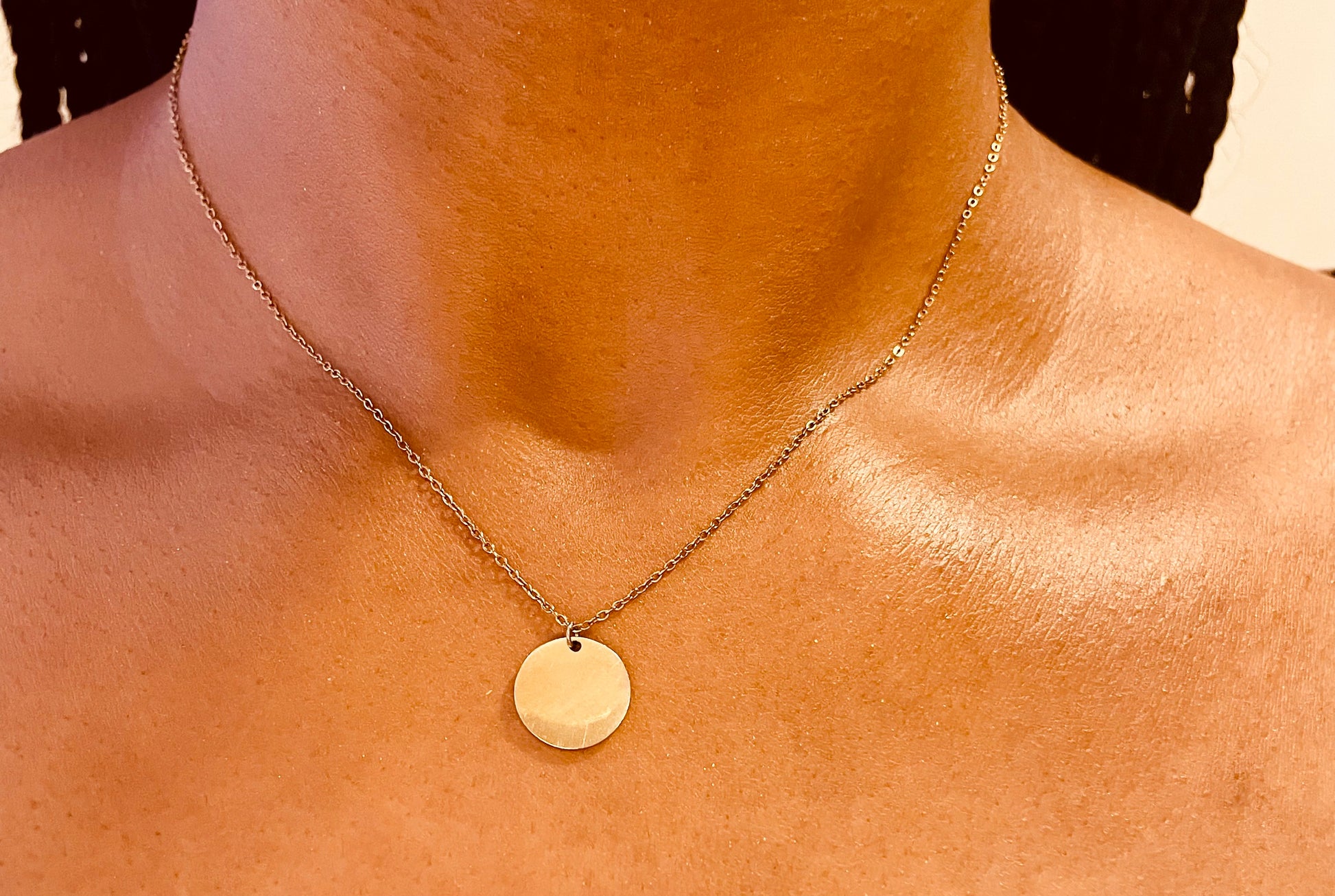 Stylish 14K gold plated minimalist round disc pendant necklace worn by a model, highlighting its chic look from GeorgiaReneeBoutique.