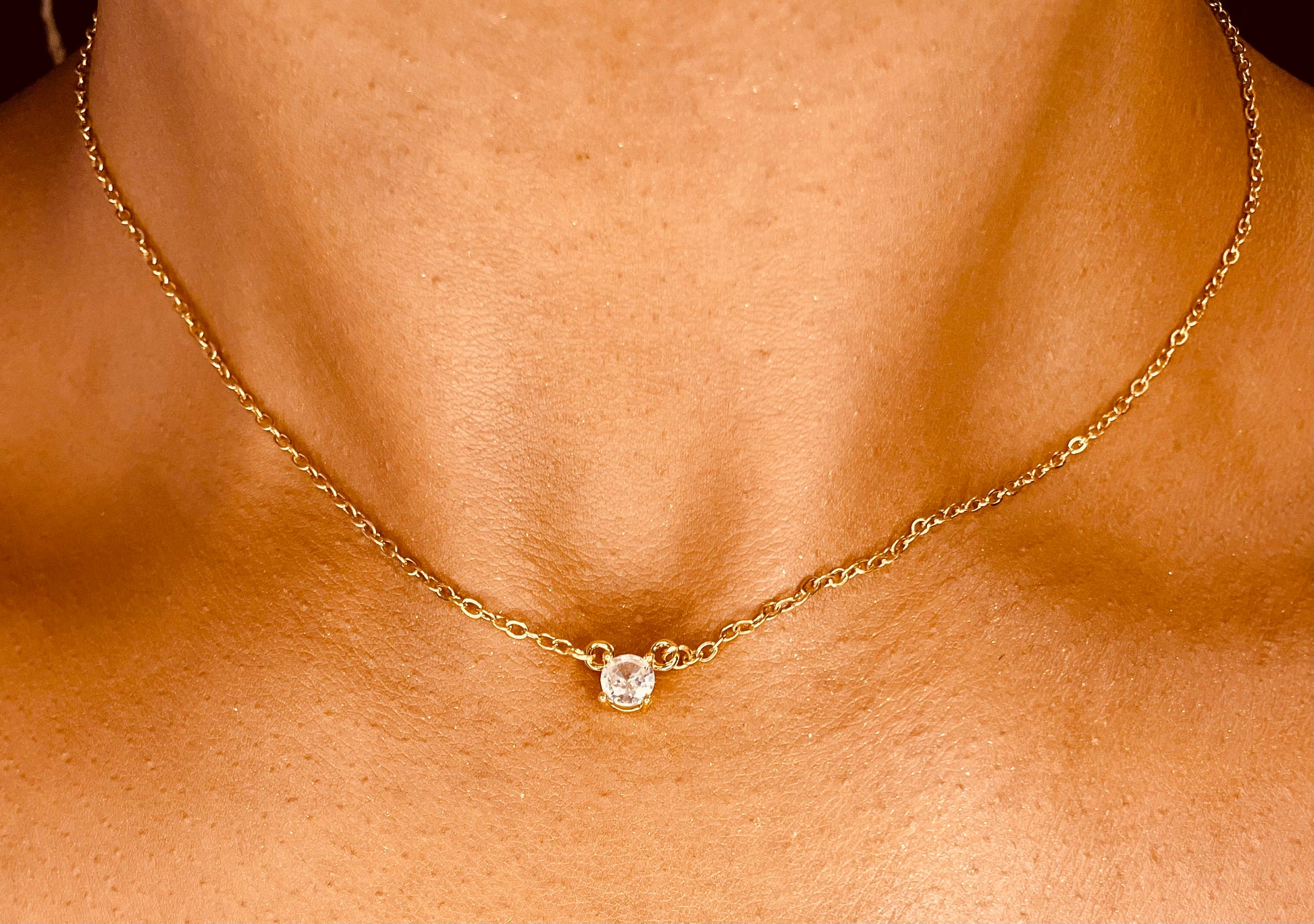 Close-up of tarnish-proof 18K gold plated steel necklace, showcasing durable and elegant craftsmanship.