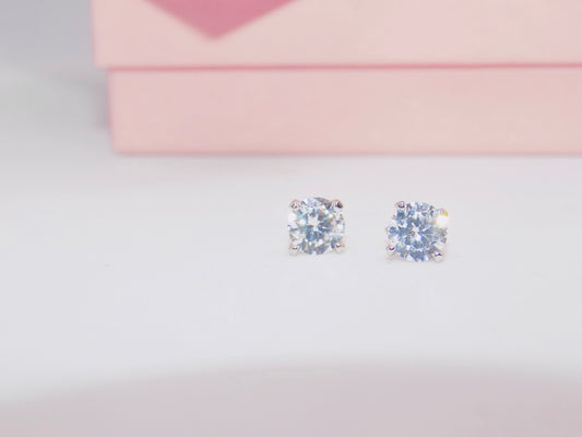 Handmade 925 sterling silver cubic zirconia geometric stud earrings, showcasing minimalist elegance from GeorgiaReneeBoutique.



