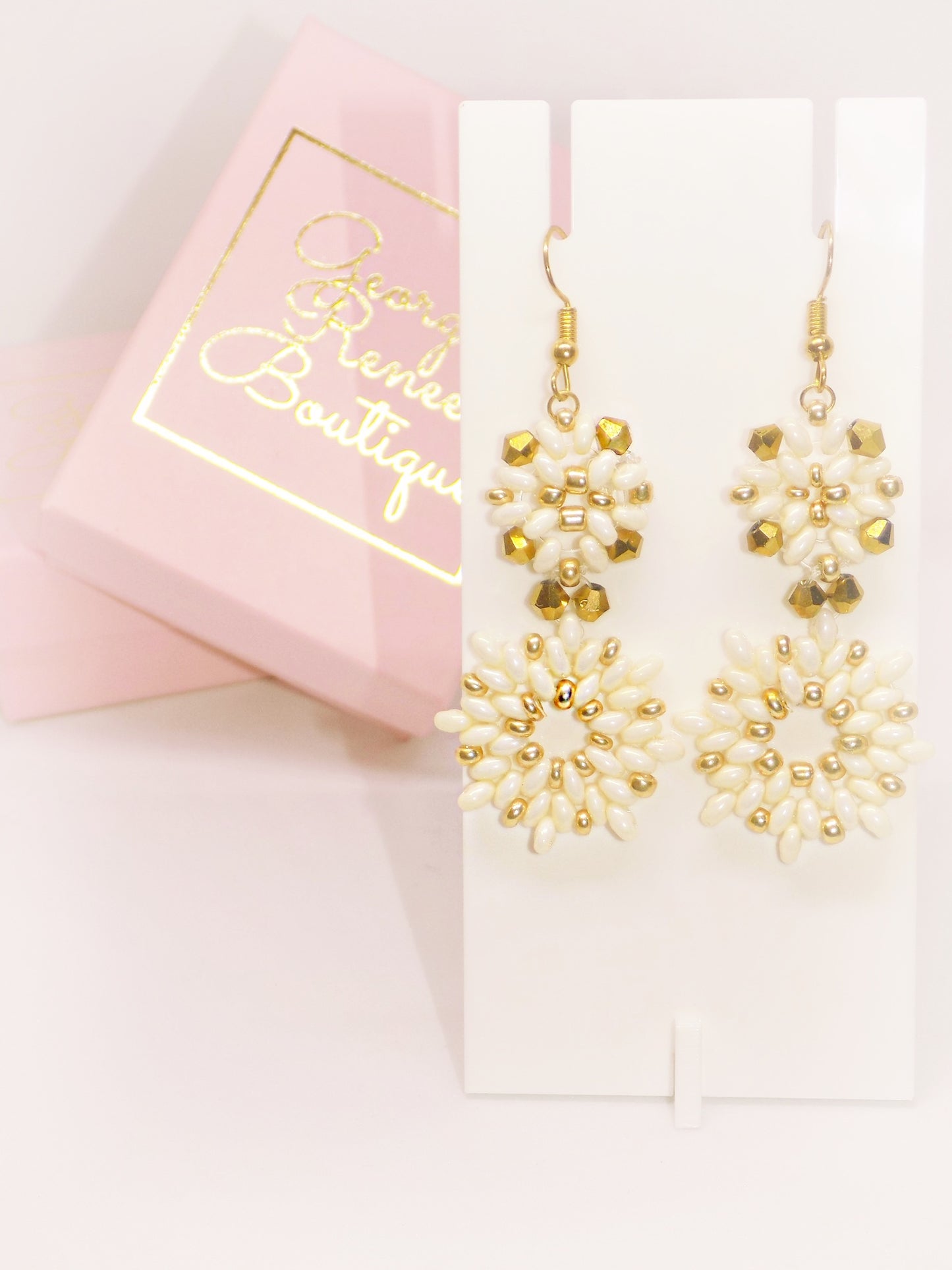 [Valentina] earrings in a trendy style, highlighting [Valentina Earrings] from the boutique.