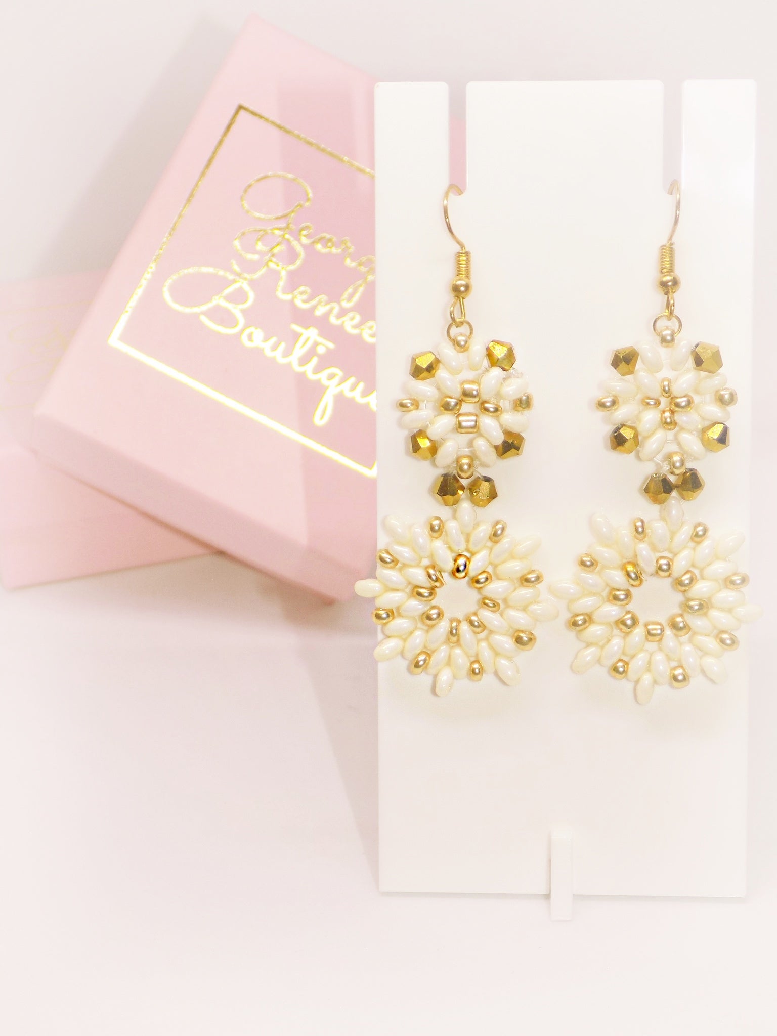 [Valentina] earrings in a trendy style, highlighting [Valentina Earrings] from the boutique.