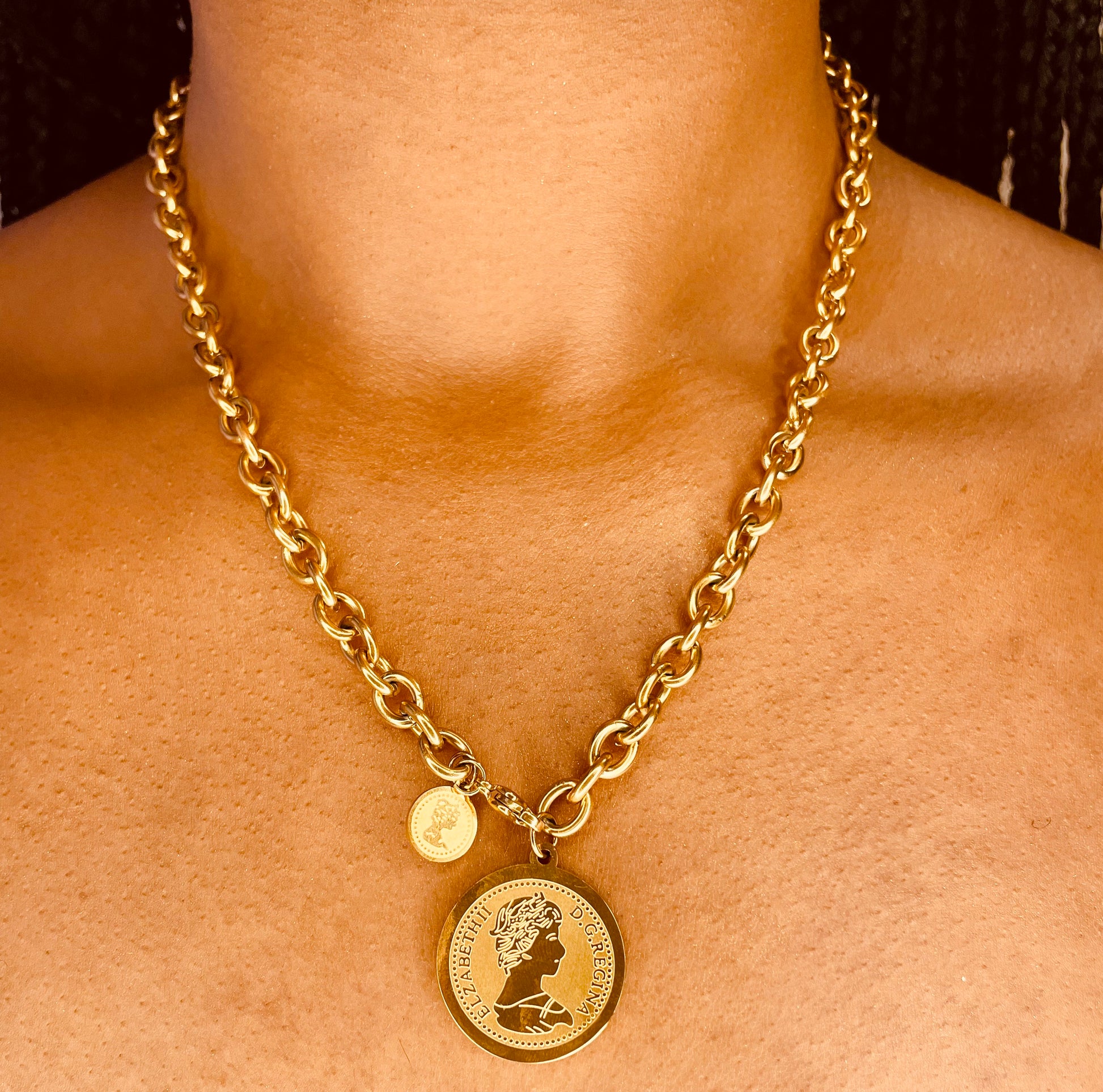 Close-up of tarnish-proof 18K gold plated coin necklace, showcasing intricate coin pendant details for lasting elegance.