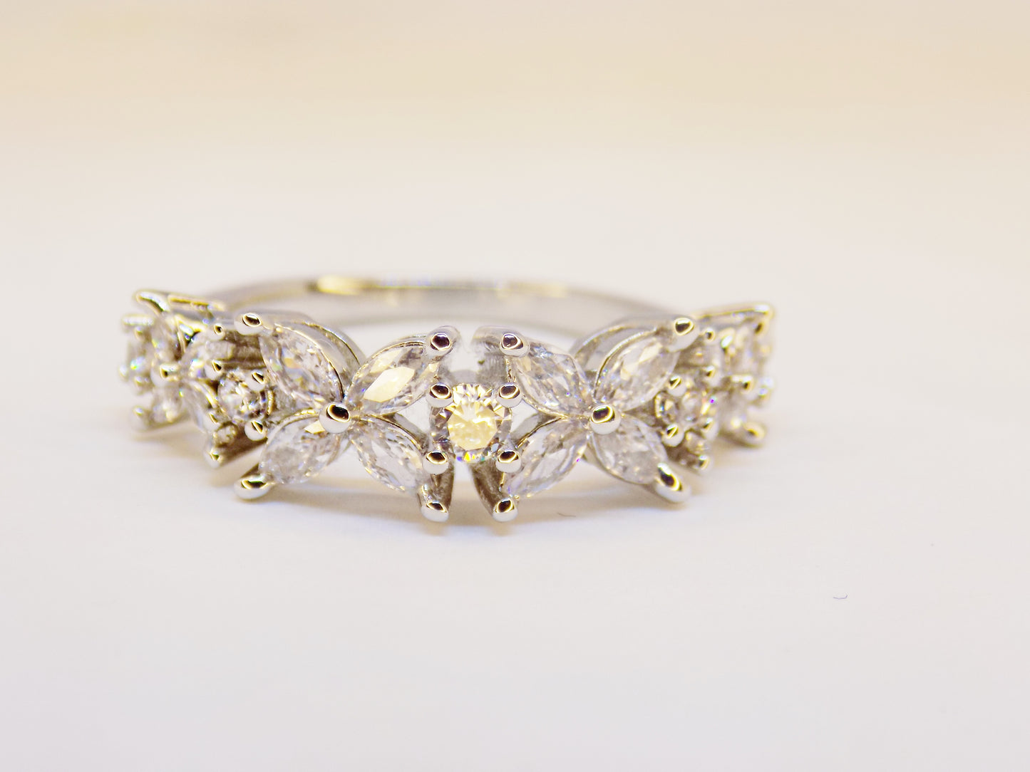 Close-up of the Lorelei 925 sterling silver ring, showcasing intricate floral prong setting with cubic zirconia stones.