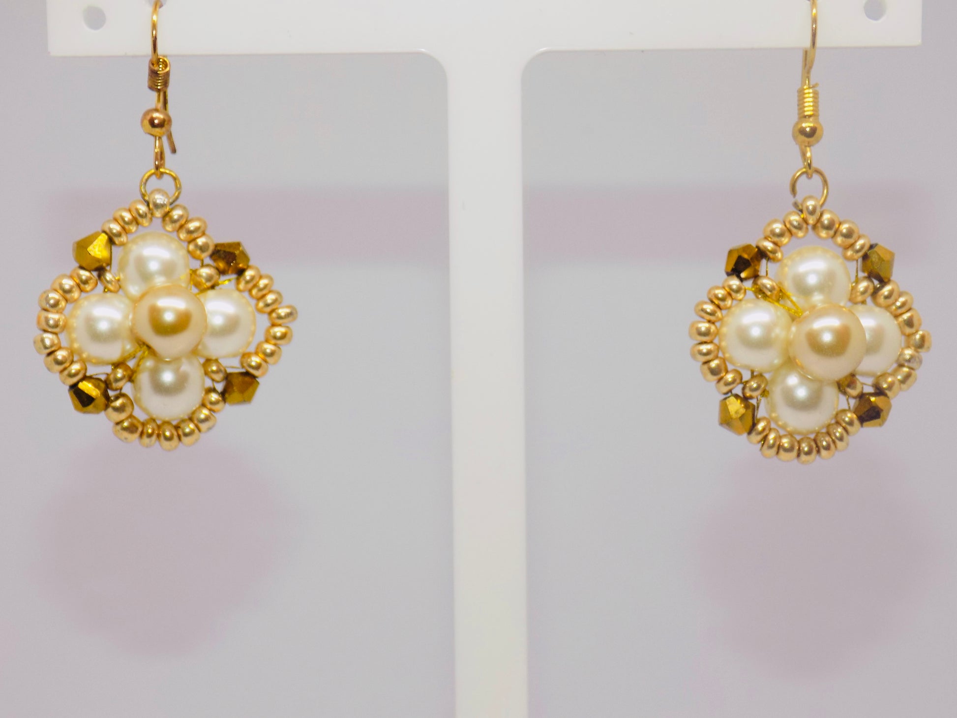 Side view of the Winsome tarnish-proof 18K gold plated necklace, featuring a delicate chain and captivating pendant design.